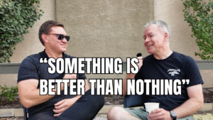 Jeff Turner interviewing a teacher outdoors, both smiling, with the quote “Something is better than nothing” displayed across the image.