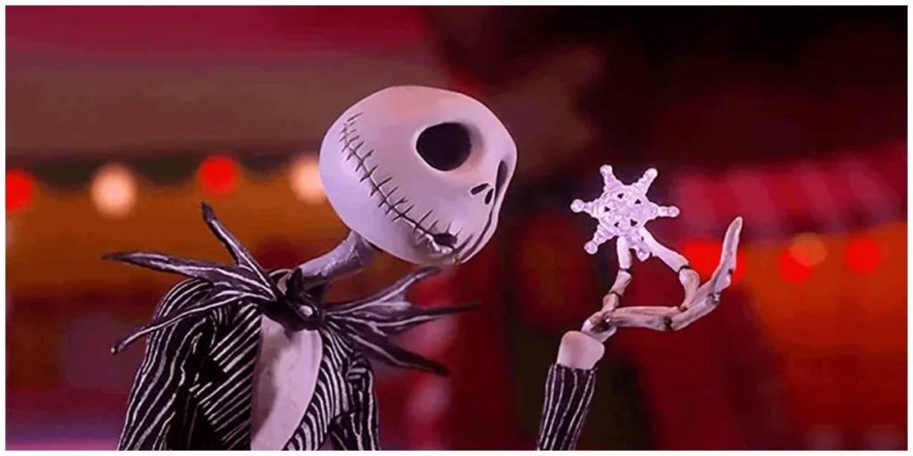 Jack Skellington from The Nightmare Before Christmas holding a delicate snowflake and examining it with curiosity against a colorful holiday backdrop.