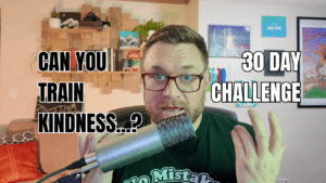 Jeff Turner speaking into a microphone during a video about kindness, with on-screen text that reads “Can you train kindness? 30 Day Challenge.”