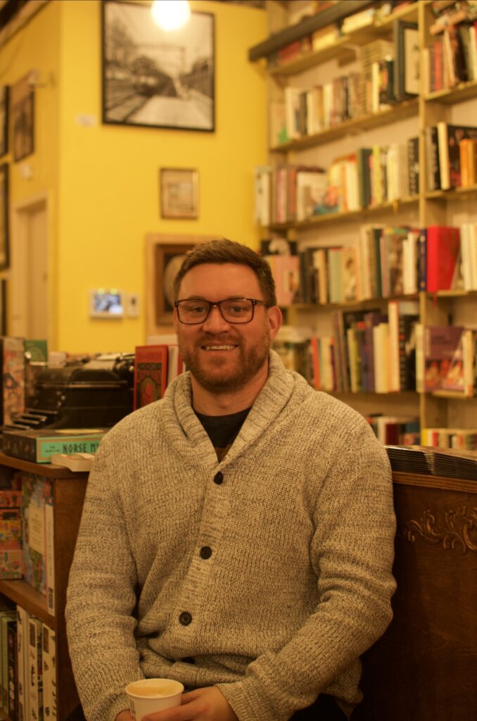 Jeff Turner sitting in a bookstore